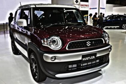 A image of Maruti Hustler in dark red colour at the showcase of car event