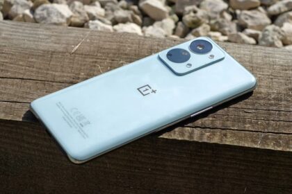 Oneplus Nord 2T with two cameras on a wood surface