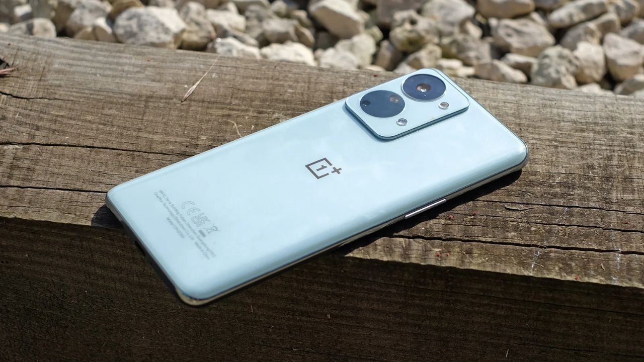 Oneplus Nord 2T with two cameras on a wood surface