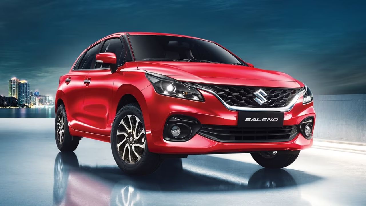 Maruti Suzuki Baleno in dark red color and some black color infront of plain white background