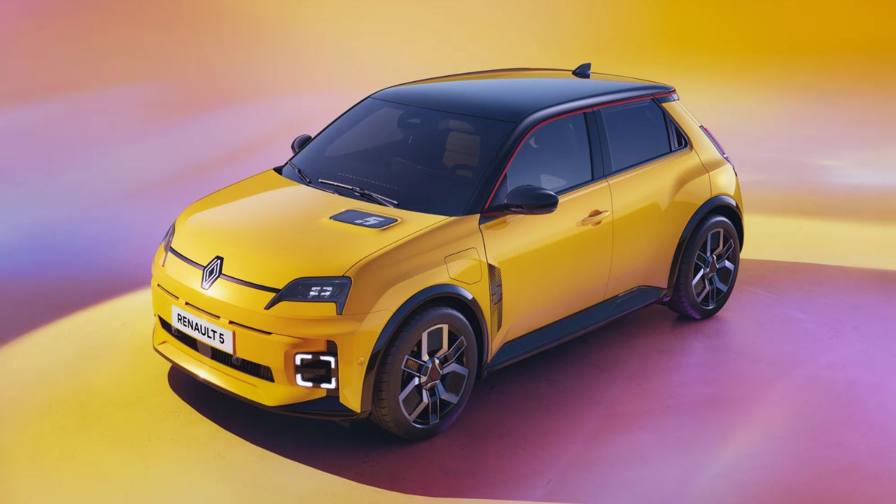 Renault 5 Electric Car in back and yellow color in yellowish and dark red background