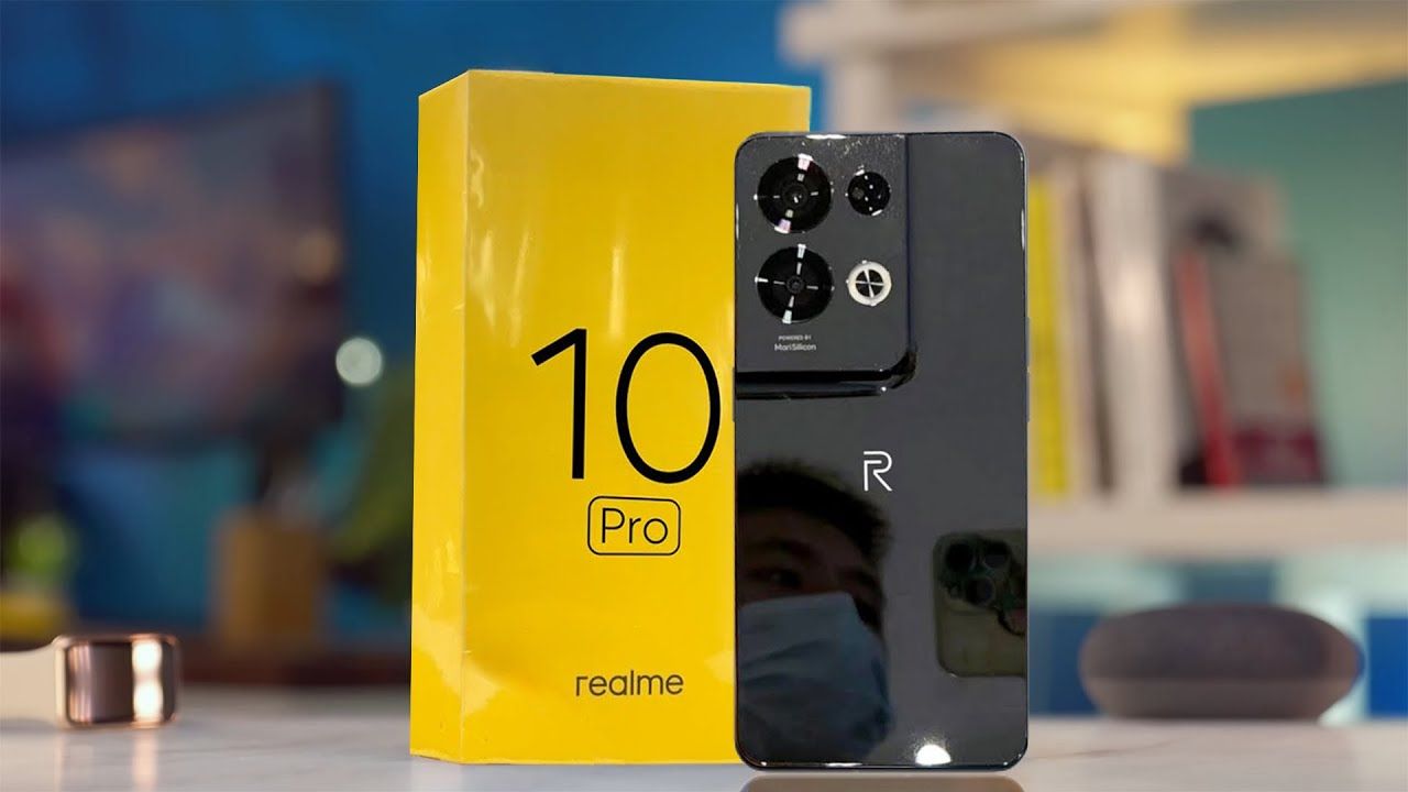 realme 10 pro 5g in black color with yellow color box on table