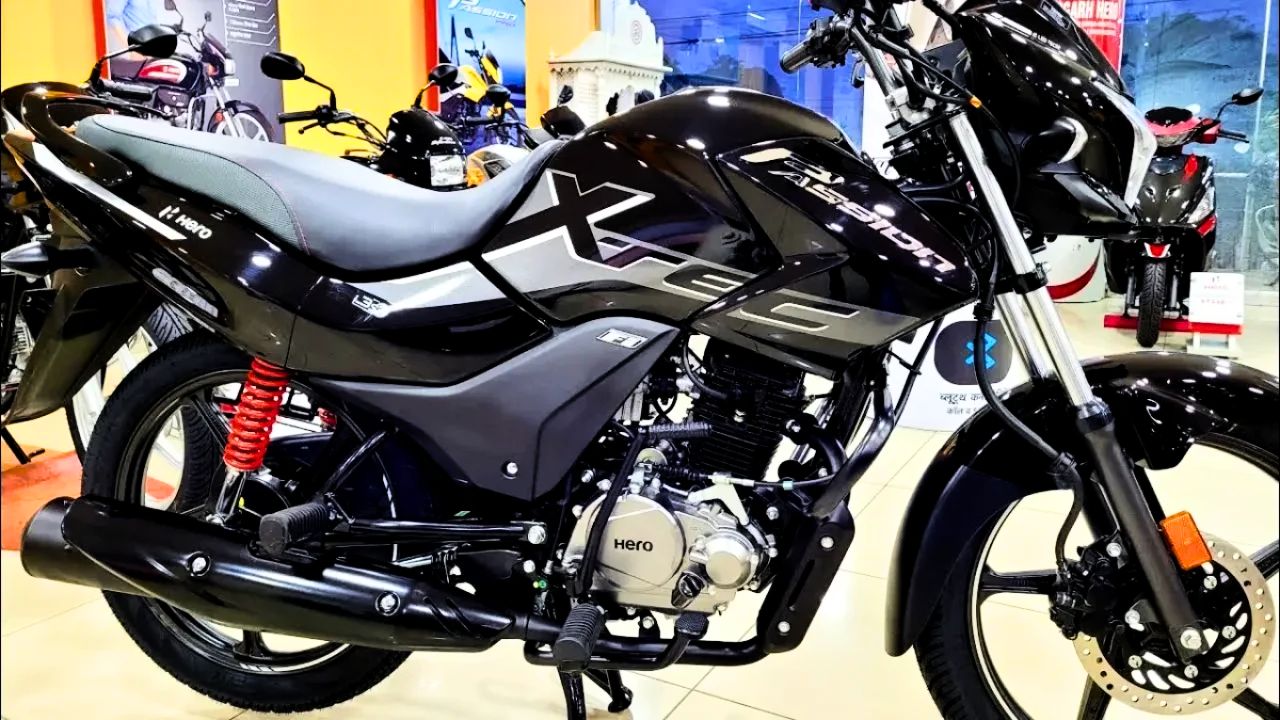 Here is image of black colour Hero Passion XTEC which is placed in showroom of hero