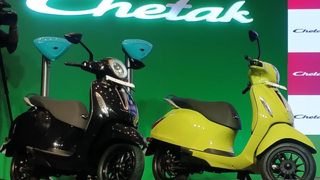 Here is image of two Electric scooter of Bajaj Chetak Which is in black and yellow colour and placed in showcase