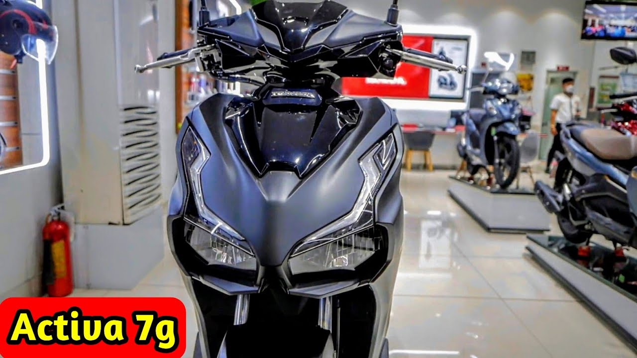 Here is image of Grey and black colour Honda Activa 7G Which is placed in showroom