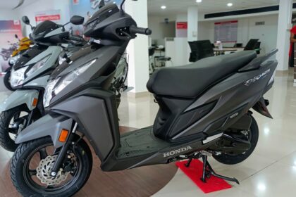 Here is image of Black colour Honda Dio scooter which is placed in showroom
