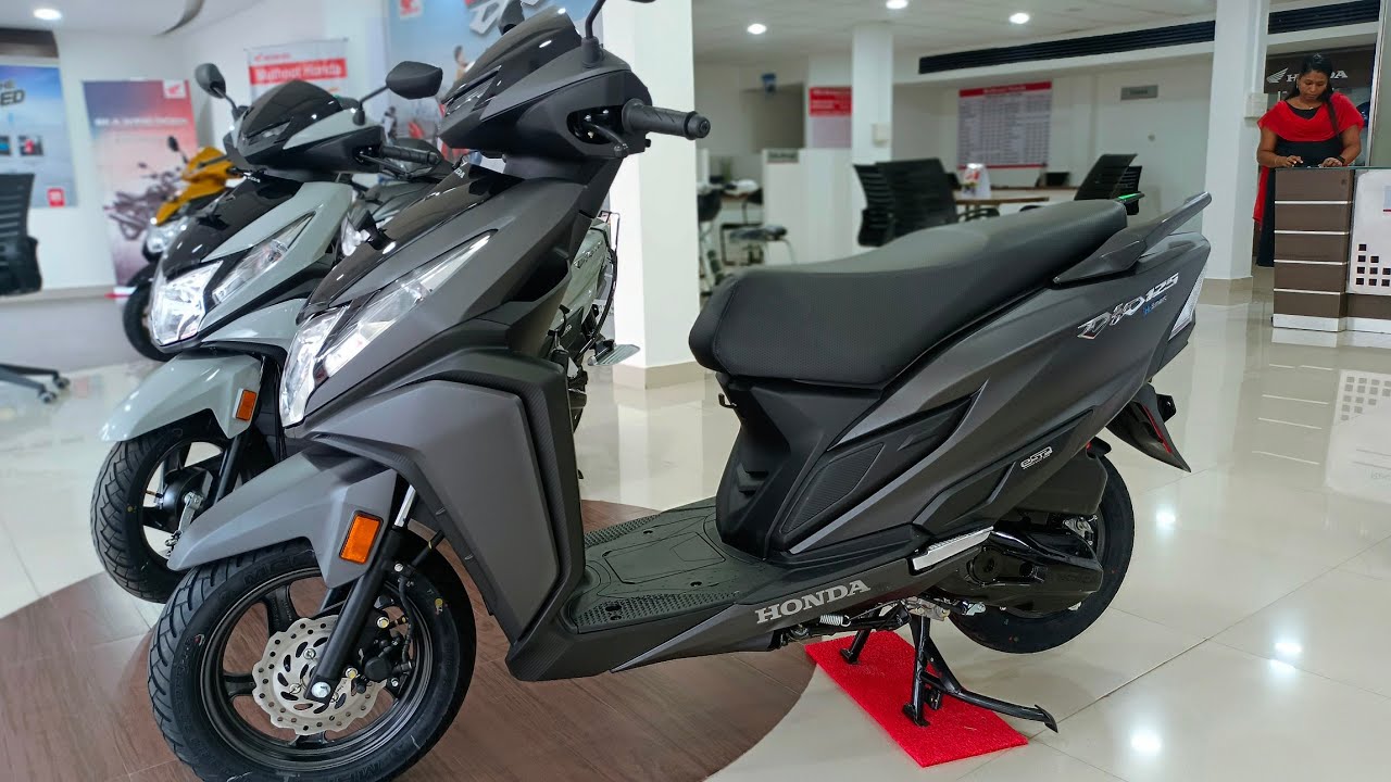 Here is image of Black colour Honda Dio scooter which is placed in showroom