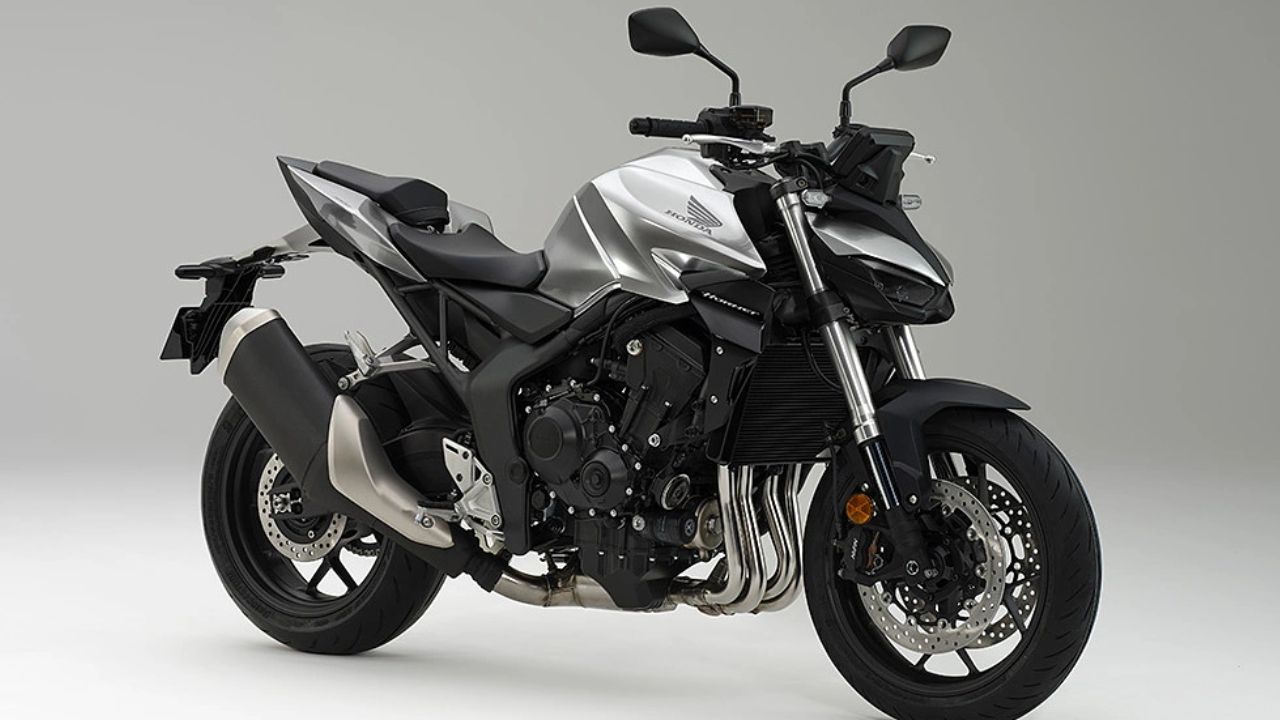 Here is Image of White and black colour Honda Hornet bike