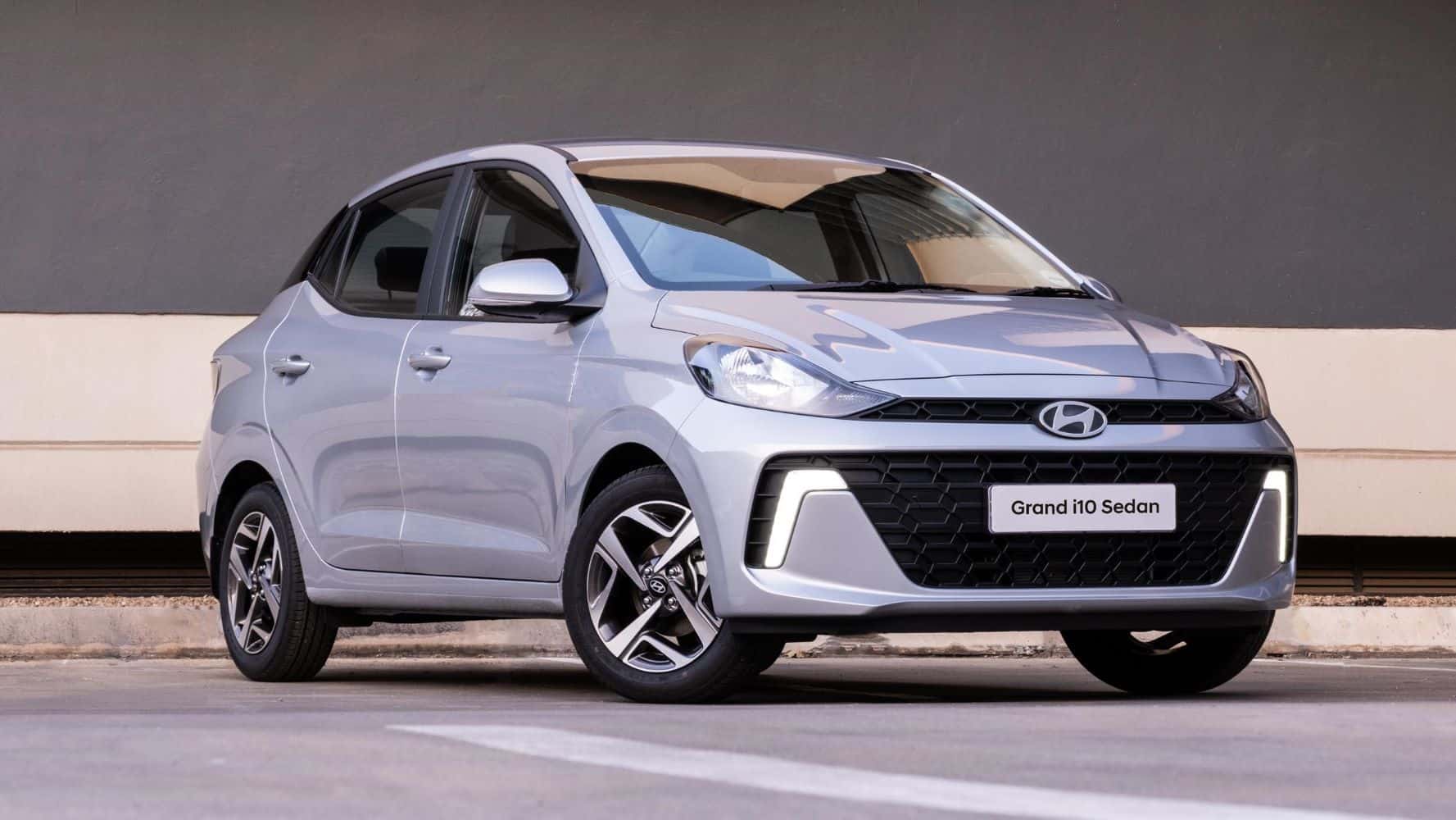 Here is Image of White colour Hyundai Grand i10 Nios Car