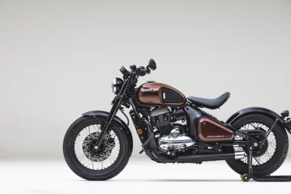 Here is Image of black and Dark brown colour Jawa 42 Bobber bike With plane White background