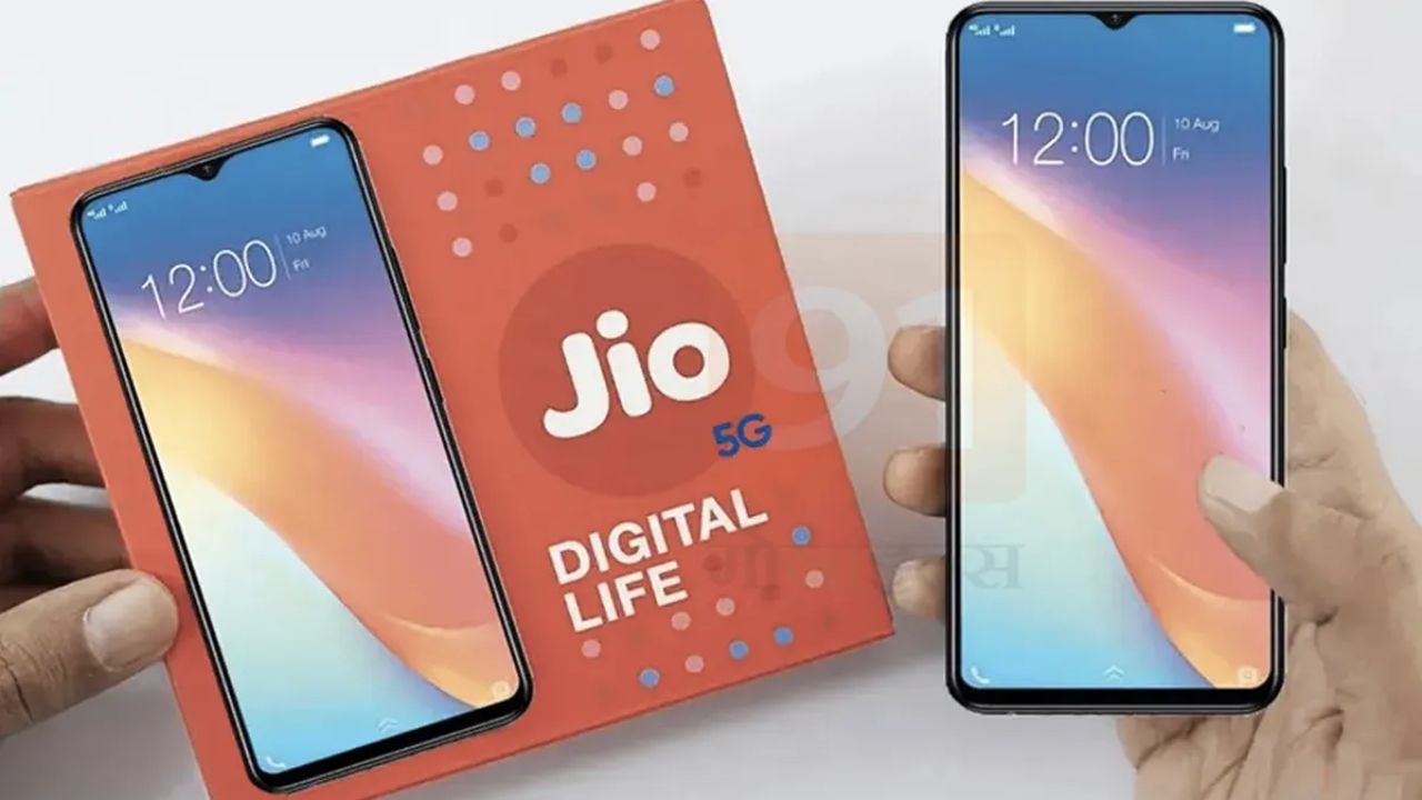 JioPhone 5G in hand with box in orange color on table