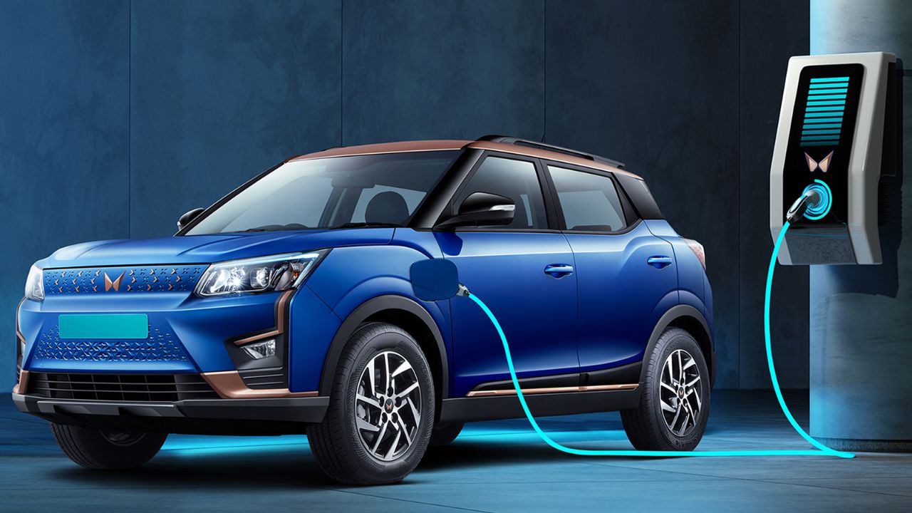 Here is image of blue colour Mahindra XUV400 Electric Car Which is on charging point
