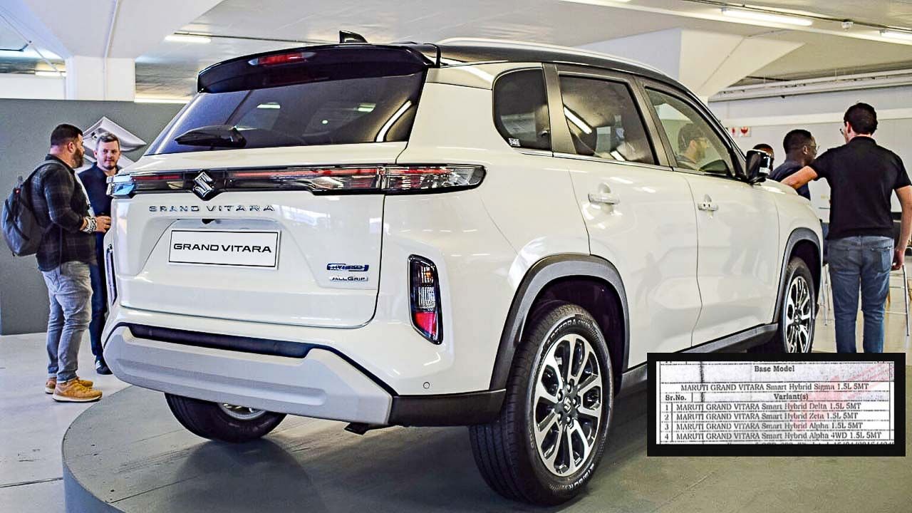 Here is image of White colour Maruti Suzuki Grand Vitara Hybrid Which is placed in showroom where many people looking the car
