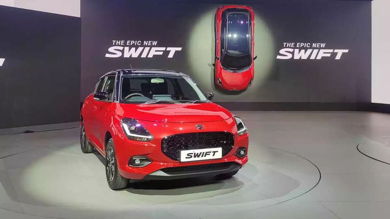 Here is image of Red Colour Maruti Suzuki Swift LXI car which is placed in showcase event