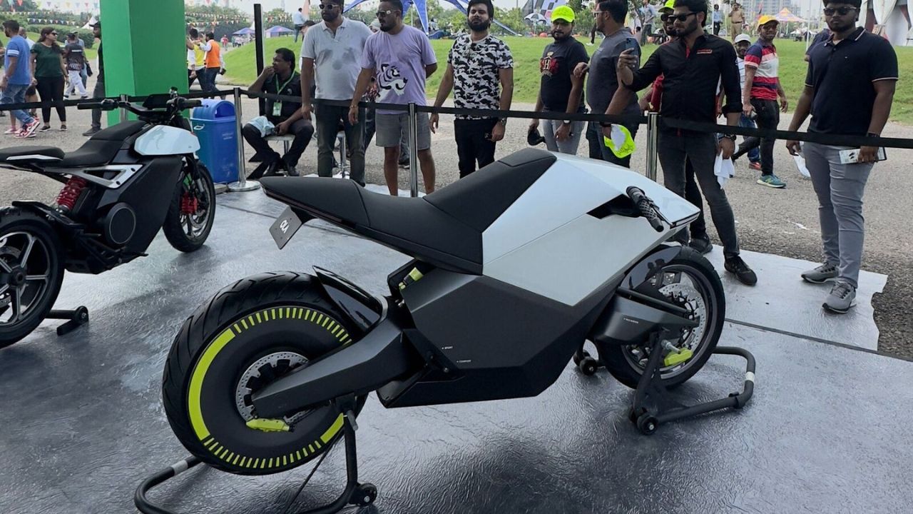 Here is image of black and Grey colour Ola Electric Motorcycle which is placed in showcase