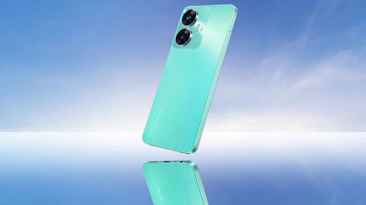 Realme C55 in mint green color infront of light blue background