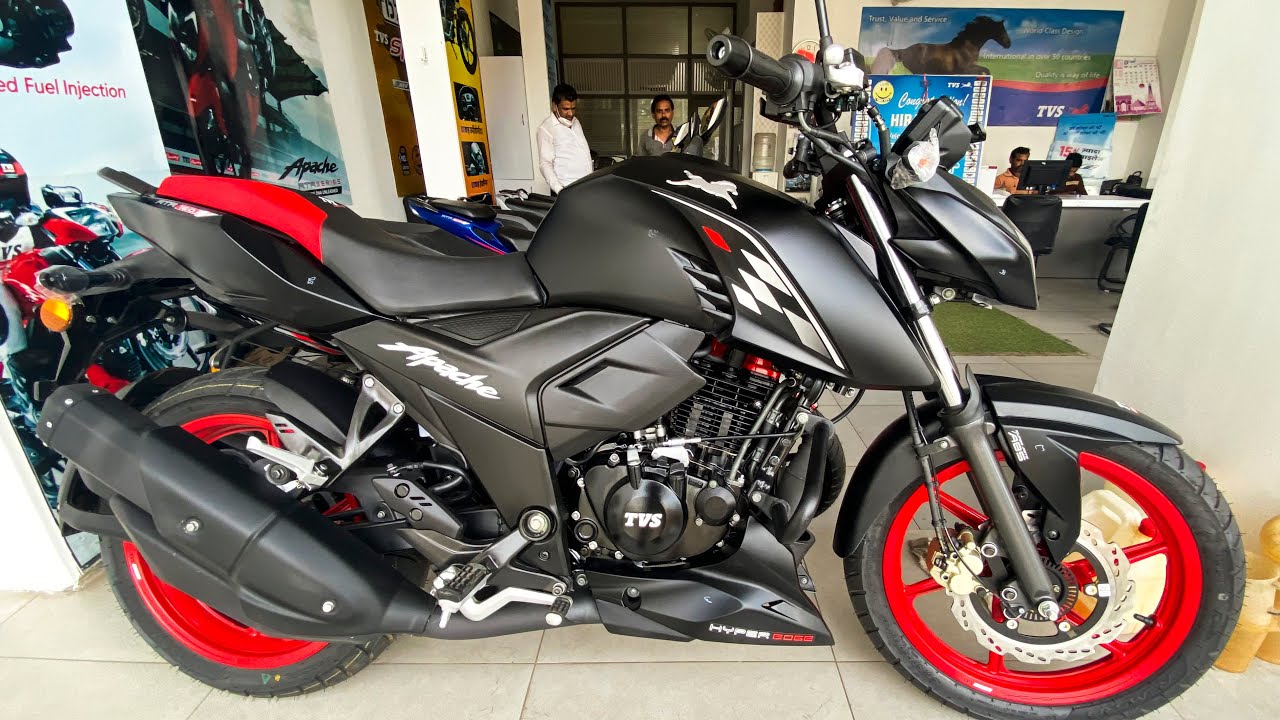 Here is image of Black and red colour TVS Apache RTR 160 Which is placed in showroom