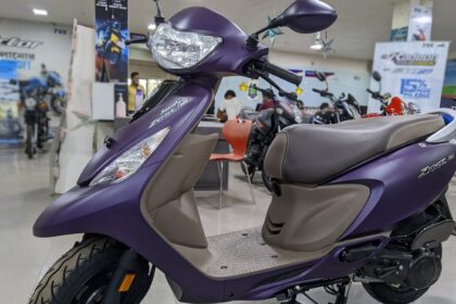 Here is image of Purple colour TVS Scooty Zest 110 Which is placed in showroom