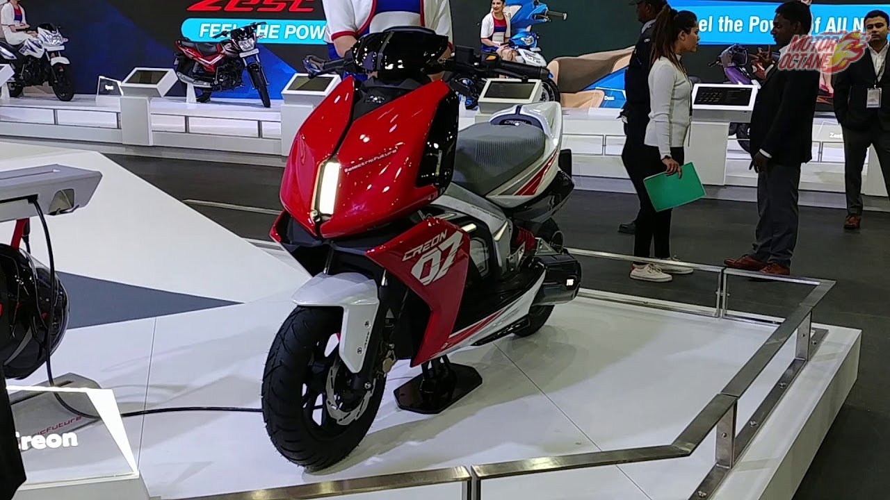 here is Image of Red colour TVS iQube Electric Scooter Which is placed in Showcase