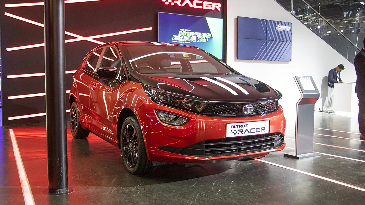 Here is Image of Black and Red Colour Tata Altroz New Car Which is placed in showroom