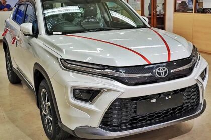 Here is image of White colour Toyota Hyryder Mini Fortuner which is placed in showroom of Toyota