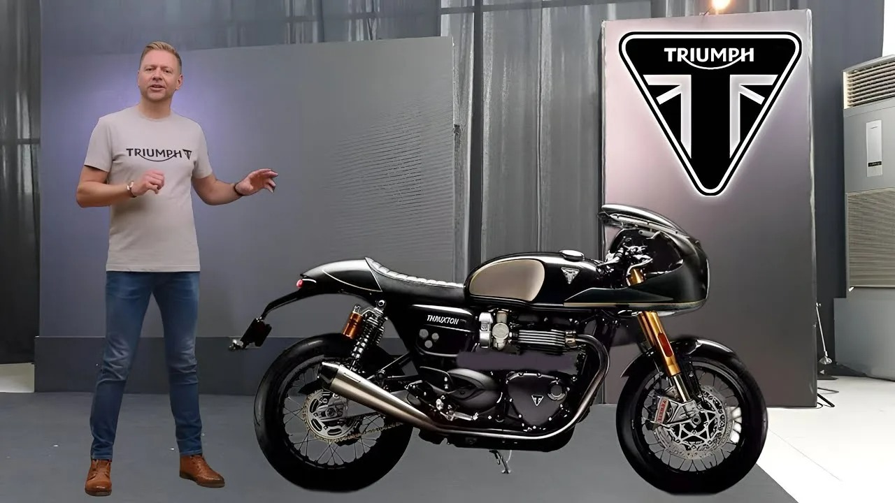 Here is image of a man explaning about a bike Triumph Thruxton 400 Which is in black colour