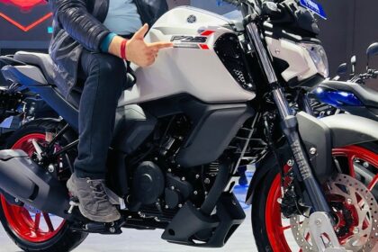 Here is image of a man sitting on a bike Yamaha FZS-FI V3 Which is in white colour