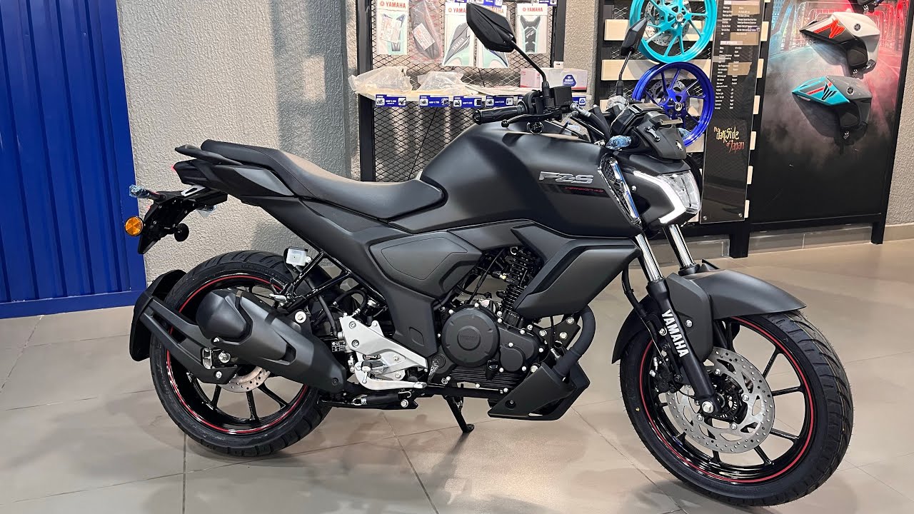 Here is image of black colour Yamaha FZS bike Which is placed in showroom
