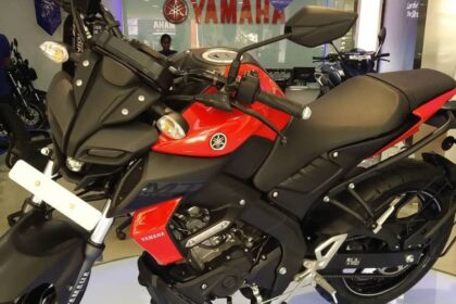 Here is Image of Black and red colour Yamaha MT 15 bike which is placed in showcase