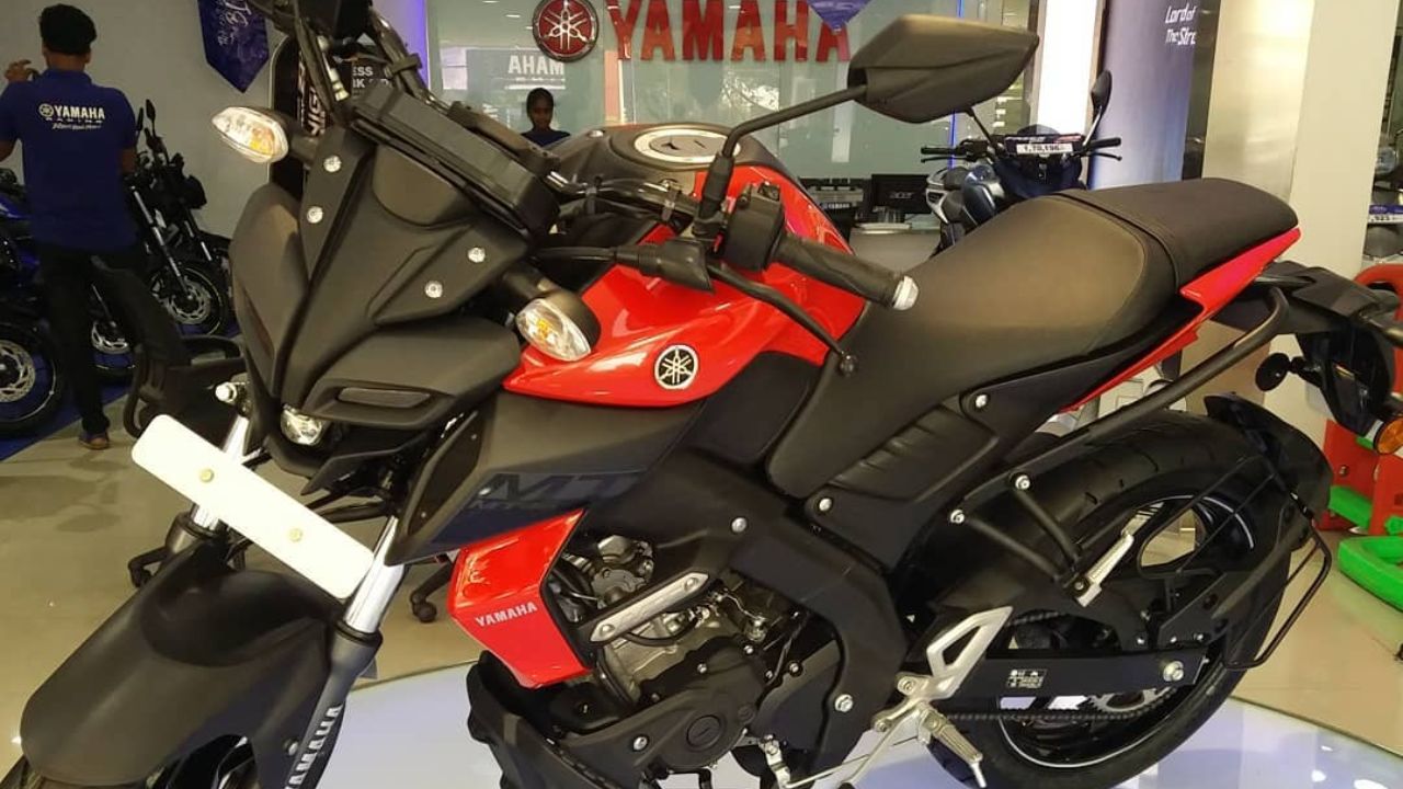 Here is Image of Black and red colour Yamaha MT 15 bike which is placed in showcase